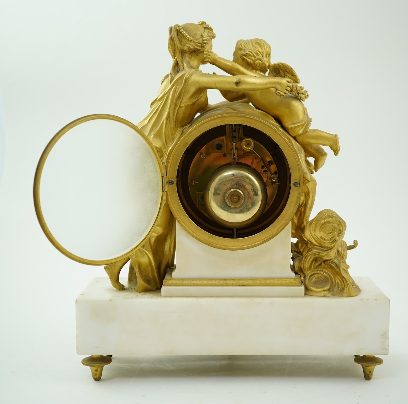An early 19th century French figural ormolu and white marble mantel clock